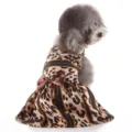 Cute leopard print dog dress detail shot showcasing soft fabric and elegant brown satin bow. - XZD311 Leopard Print