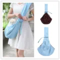 Light blue pet sling carrier with polka dot lining, breathable fabric design for small dogs. - XBD89 Blue Double-Sided Polka Dots