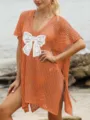 Gedetailleerd overzicht vrouwen oranje gehaakte bikini strandjurk met witte kanten strik. - Eén maat / Dresses / Oranje