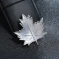 Close-up detail of silver maple leaf brooch with delicate textured metal finish - Matte Silver Brushed Maple Leaf Style / Silver