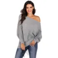 Close-up detail of grey off-shoulder batwing knit sweater, soft texture, stylish casual wear. - M / Gray