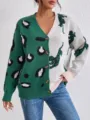 Close-up of color-blocked knit cardigan featuring leopard and tiger jacquard patterns. - One Size / Dark Green