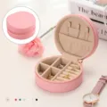 Pink round travel jewelry box with zipper for rings, earrings and necklaces storage - Pink
