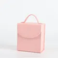 Portable pink jewelry storage box with handle for elegant travel jewelry organization - Pink