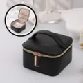 Elegant black portable PU leather jewelry storage box featuring golden zipper and handle - 12x12x7cm / Black PU Leather