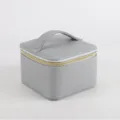 Portable grey leather jewelry storage box with top handle and secure golden zipper - Slate Gray