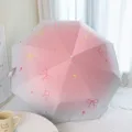 Sombrilla degradado rosa con lazos rojos y estrellas, diseño plegable para sol y lluvia. - Paraguas Manual de 3 Pliegues (Lazo en Degradado) / Rosa Melocotón