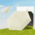 Kompakter cremefarbener Kapselschirm mit UPF 50+ UV-Schutz für Sonne und Regen geeignet - 6 Knochen mit Aufbewahrungsbox / Milchgelb