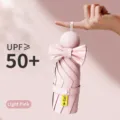 Ombrello a capsula pieghevole rosa chiaro compatto con fiocco per protezione solare portatile - 8 Bacchette 5 Pieghi (Rivestimento Nero) / Rosa