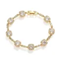 Detail view of gold-tone bracelet featuring square elements with sparkling clear stones - Gold with White Stone