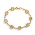 Close-up detail of a gold-plated bracelet with yellow cushion-cut crystals and micro-pavé - Gold Yellow Rhinestone