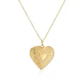 Macro detail of a vintage engraved heart-shaped gold photo locket necklace pendant. - Floral Pattern Heart Locket