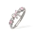 Macro view of elegant silver ring with pink crystal bow and heart-shaped stones. - Silver Pink Zirconia Bowknot Ring