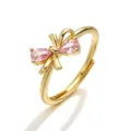 Elegant gold adjustable ring with a pink pear-cut stone bow design detail shot - Gold Pink Zirconia Ribbon Bowknot Ring
