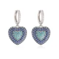 Detailed front view of silver-tone hoop earrings with blue pavé-set heart pendants - Blue Zirconia Heart Earrings / 1 Pair Pack / White Gold