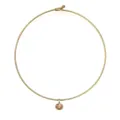 Detailansicht eines goldenen Edelstahl-Chokers mit einem ovalen champagnerfarbenen Stein. - Gold Champagner Zirkonia Oval Choker