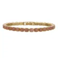 Macro view of a gold-plated tennis bracelet with 5mm candy colored ice flower zircons - Gold A24 Light Coffee