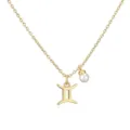 Close-up detail of gold Gemini zodiac symbol pendant and white pearl on a fine chain - Gemini