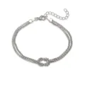 Vista dettagliata del bracciale con nodo dell'infinito e catena a più fili argento. - Nodo Infinito Intrecciato / Oro bianco