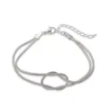 Dettaglio di un bracciale a doppia catena a serpente con nodo dell'infinito argentato - Nodo Infinito Catena a Serpente / Oro bianco