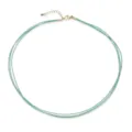 Detailed view of a triple-layer mint green hand-woven cord necklace with gold hardware - Cyan Green