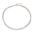 Detailed view of a triple-strand hand-braided cord necklace with adjustable gold clasp - Purple