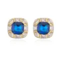 Macro view of 18K gold plated square earrings featuring a large blue gemstone and pavé halo - Blue Zirconia / Gold