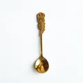 Elegant golden stainless steel coffee spoon with detailed carved rose flower handle - Spoon / Gold