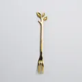 Elegant golden stainless steel fruit fork featuring a creative decorative leaf handle - Gold Disposable Forks / Gold