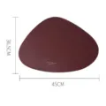 Irregular burgundy faux leather placemat with heat insulation and waterproof coating, 45x36.5cm - Burgundy