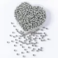 Macro shot of 3x4mm silver metallic acrylic pony beads inside a heart-shaped container - 500g (Approx 8000 Pieces) / Silver
