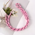 Detailed macro of a pink braided rope bag charm featuring a unique hand-tied loop knot - 33# Deep Pink and Black