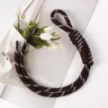 Detailed view of a handcrafted brown woven rope bag charm with white dotted patterns. - 41# Dark Reddish Brown with White