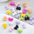 Close-up detail of colorful painted bowknot alloy spacer beads for DIY jewelry making accessories. - 27# Bow