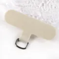 Close-up detail of a universal fabric phone tether tab with metal D-ring in beige. - Light Khaki