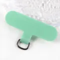 Close-up detail of green phone lanyard tether tab with metal ring, durable TPU material. - Mint Green