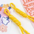 Detailed view of two vibrant yellow braided nylon ropes with white decorative weave - 1 Piece/Pack / Yellow