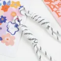 Close-up of white braided nylon lanyards with black dashed patterns for phone or bag charms - 16# White and Black