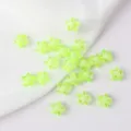 Macro detail view of 11mm neon green acrylic star beads for creative DIY jewelry making. - 50 Pieces/Pack / Transparent Green with White Core