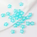 Macro view of cyan acrylic 11mm star beads for DIY necklace jewelry making - 50 Pieces/Pack / Transparent Cyan with Blue Core