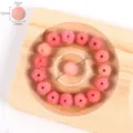 Pink carved lotus bodhi beads detail view showing fine floral engraving and dimensions. - 05# Small Pink Lotus