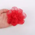 Detailed close-up of a red handmade chiffon fabric flower showing exquisite burnt-edge texture. - Red