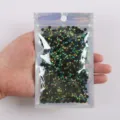 Schwarze holografische flache Kunstharz-Strasssteine für Nailart und DIY-Bastelarbeiten. - 2 mm - 5000 Stück / 58 Pfauengrün AB