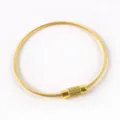 Close-up detail of a golden wire keychain loop, durable metallic finish and screw connector. - 14# Gold