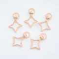 Detailed view of five nude pink star-shaped metal swivel lobster clasps for DIY - 1 Piece / Nude Pink