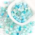 Close-up macro view of mixed blue and white glass beads for DIY jewelry making crafts - 20.00g / 08