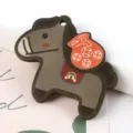 Detailed view of cartoon wooden horse pendant with money bag design for DIY jewelry - 1 Piece / 02# Brown