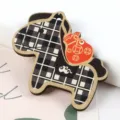 Close-up of a horse-shaped wooden pendant with plaid pattern and red money bag. - 1 Piece / 03# Coffee Plaid