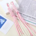 Close-up of pink and white handmade braided nylon rope bag charm with tassel detail - 1 Piece / 09# Cream White + Pink Dots