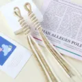 Detailed view of dual-color hand-woven nylon cords with tassels for DIY bag charms - 1 Piece / 13# Beige + Khaki Dots